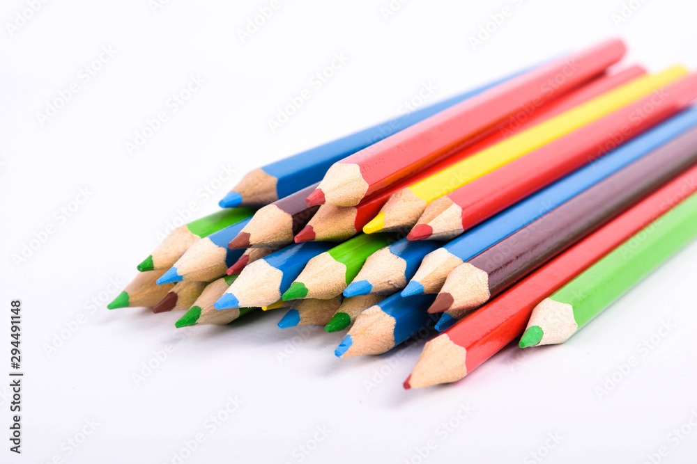 Many different colored pencils on a white background with a place for text and cory space . Many different colored pencils on a white background with a place for text and cory space .