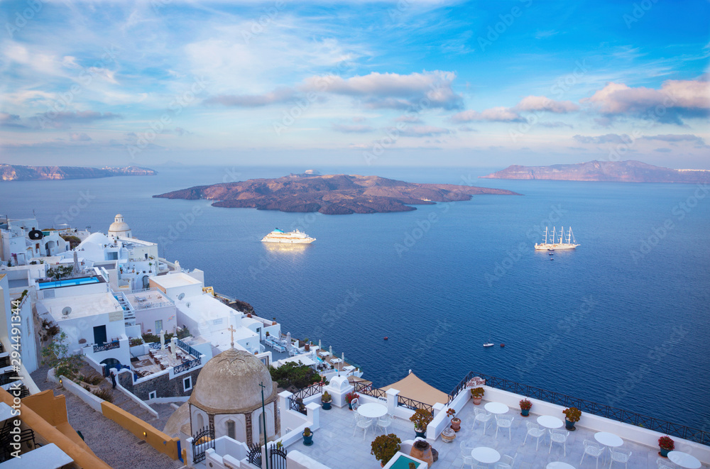 Santorini - The outlook from Fira to caldera with the Nea Kameni Island in morning light.