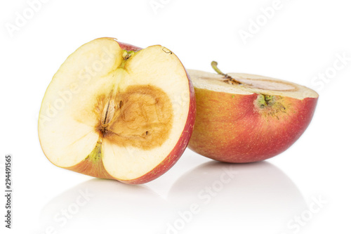 Group of two rotten halves of jonagold red apple isolated on white background