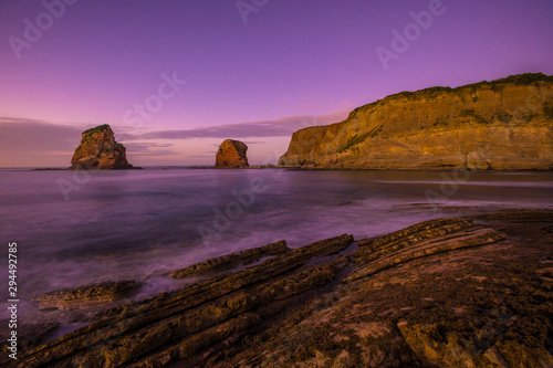 Rocks of Two Sisters of Hendaye with the purple sky. France © unai