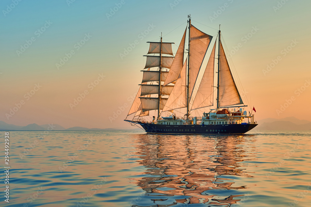 Sailing ship. Sailboat in the sea under sail. Yachting sport and cruise Sailing ship. Sailboat in the sea under sail. Yachting sport and cruise