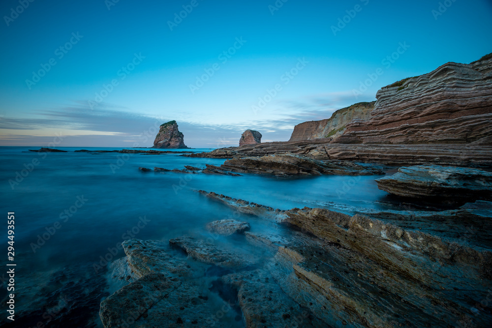 Fototapeta premium Rocas Dos Hermanas de Hendaya with cold winter retouching. France