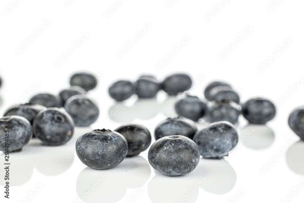 Lot of whole disordered fresh blue blueberry isolated on white background Lot of whole disordered fresh blue blueberry isolated on white background