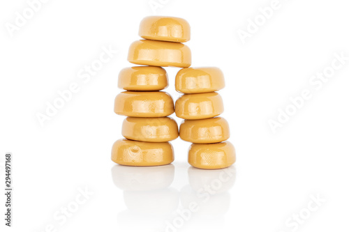 Lot of whole arranged caramel brown candy isolated on white background