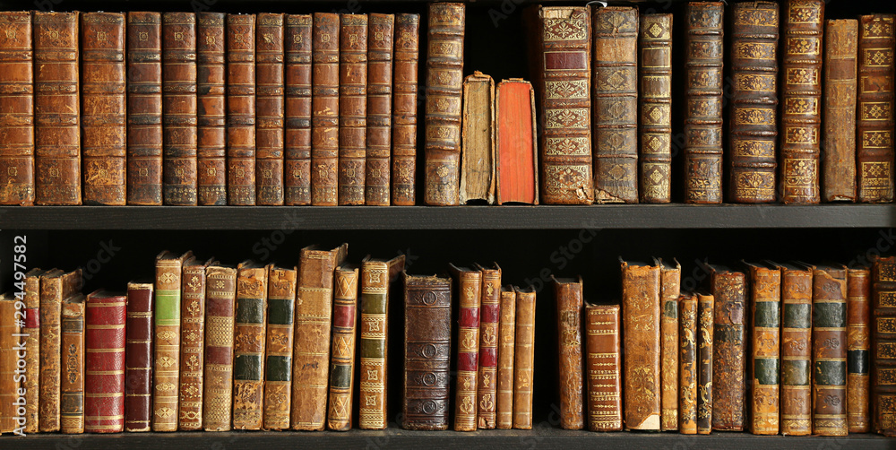 old books on wooden shelf