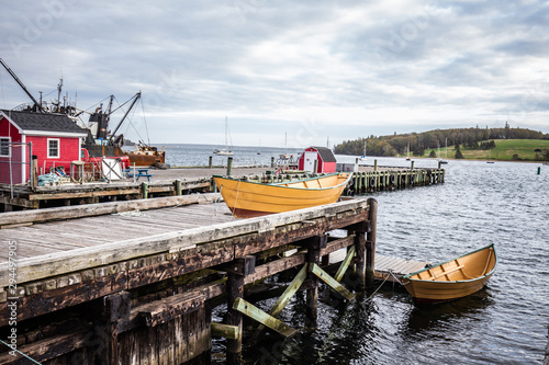 Obraz na plátně Small yellow boat in the harbor in Lunenburg Nova scotia