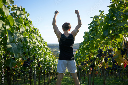 Succeeded runner rising his arms photo