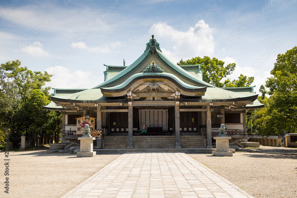 Japanese wood temple with a sexy blue and cloudy sky