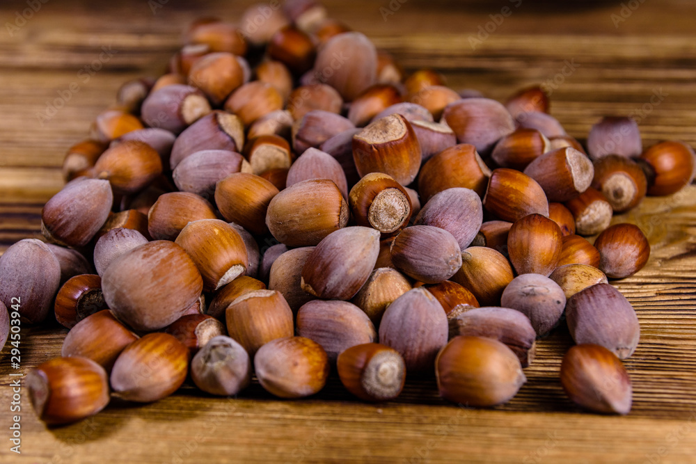 Pile of the hazelnuts on wooden table