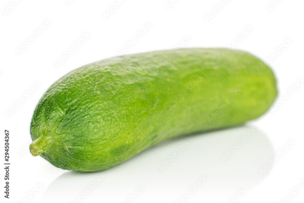 One whole mini green cucumber isolated on white background One whole mini green cucumber isolated on white background