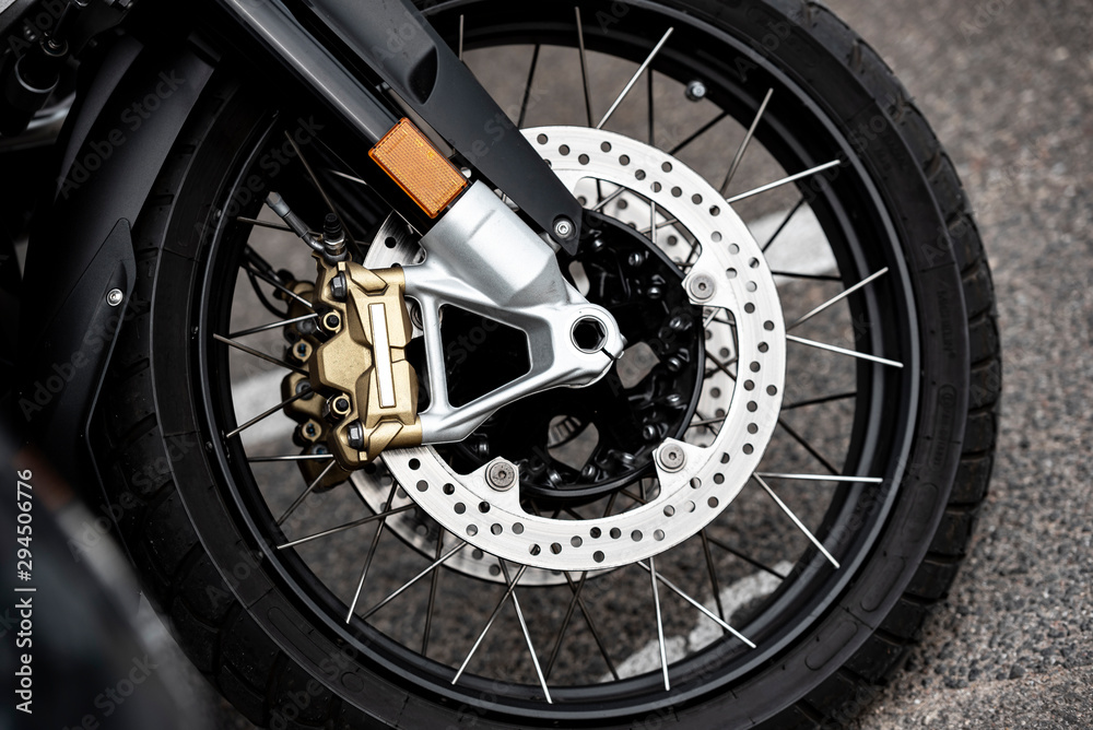 Front Motorcycle wheels in closeup. Front Motorcycle wheels in closeup.