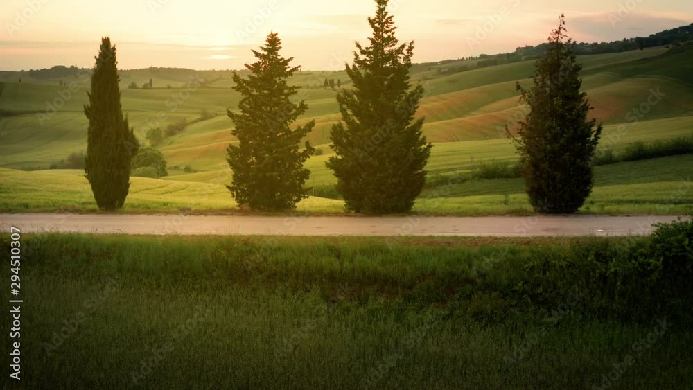 Flying over the amazing rolling hills of Tuscany Italy at sunset