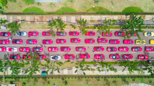 Фотография Crowded Ferrari cars in line on the road