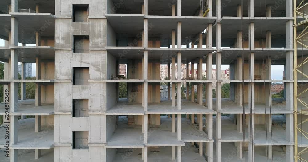 Aerial view of high rise residential complex under construction. Construction of apartment building in green zone. Multi-storey modern residential complex under construction Aerial view of high rise residential complex under construction. Construction of apartment building in green zone. Multi-storey modern residential complex under construction
