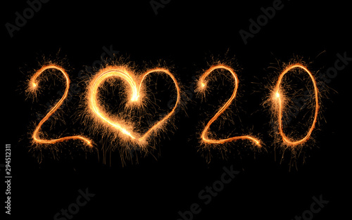 Sparklers forming figure 2020 on black background