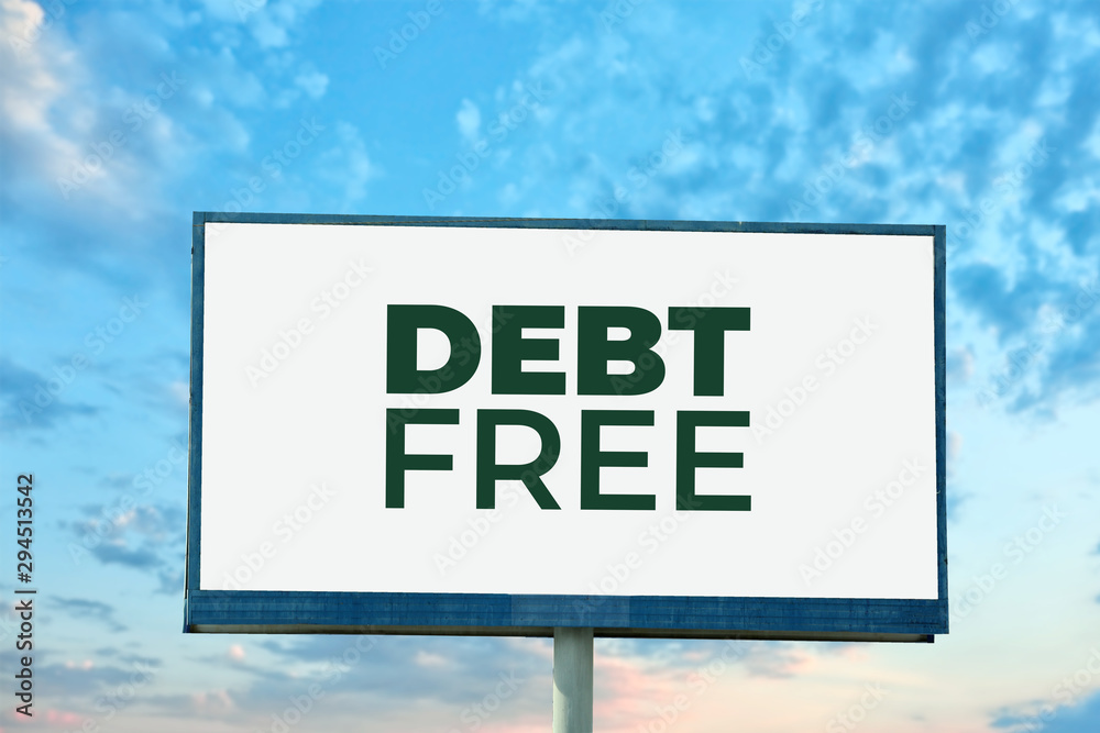 Billboard with text DEBT FREE against blue sky