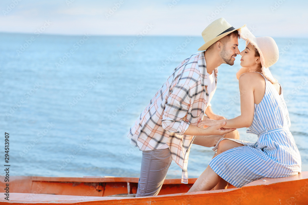 Happy couple in boat at sea resort
