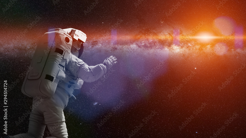 Fototapeta premium astronaut in outer space flying towards the stars