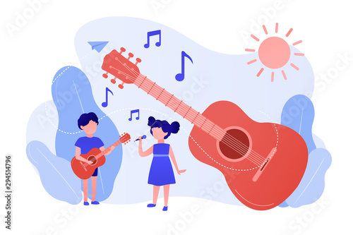 Happy kids enjoy singing and playing the guitar at summer camp, tiny people