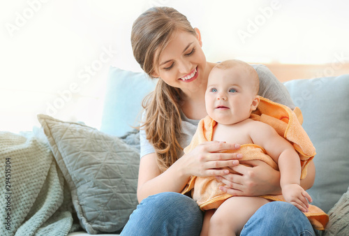 Mother wiping her cute litt...