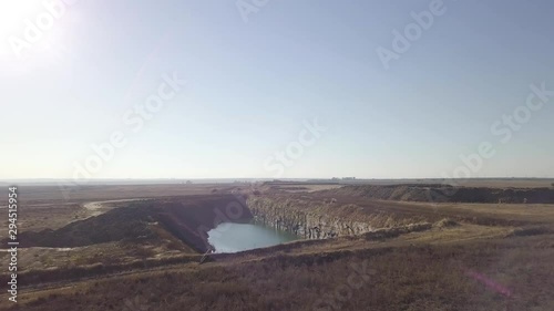 Drone shot of birds flying towards quarry photo