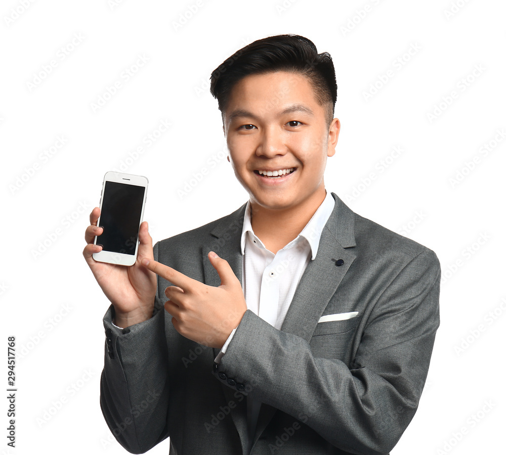 Portrait of Asian businessman with mobile phone on white background Portrait of Asian businessman with mobile phone on white background