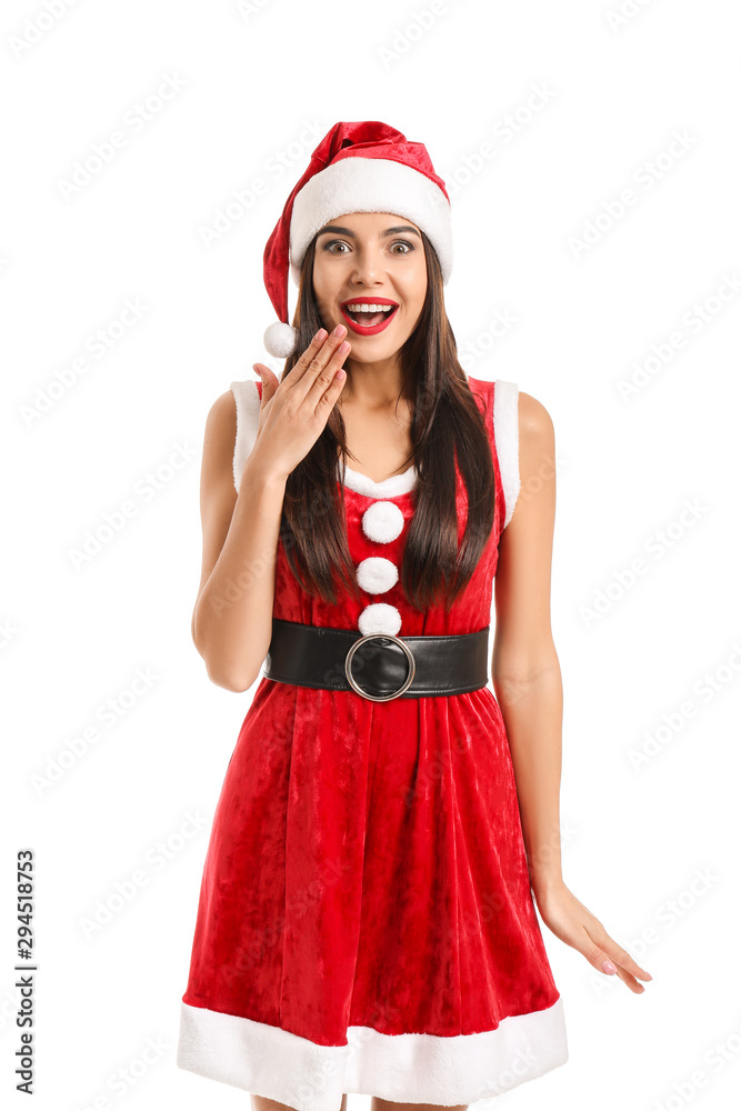 Surprised young woman in Santa Claus costume on white background Surprised young woman in Santa Claus costume on white background