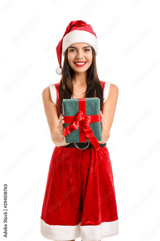 Beautiful young woman in Santa Claus costume and with gift on white background Beautiful young woman in Santa Claus costume and with gift on white background