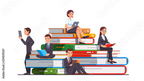 Business people sitting on a big stack of books