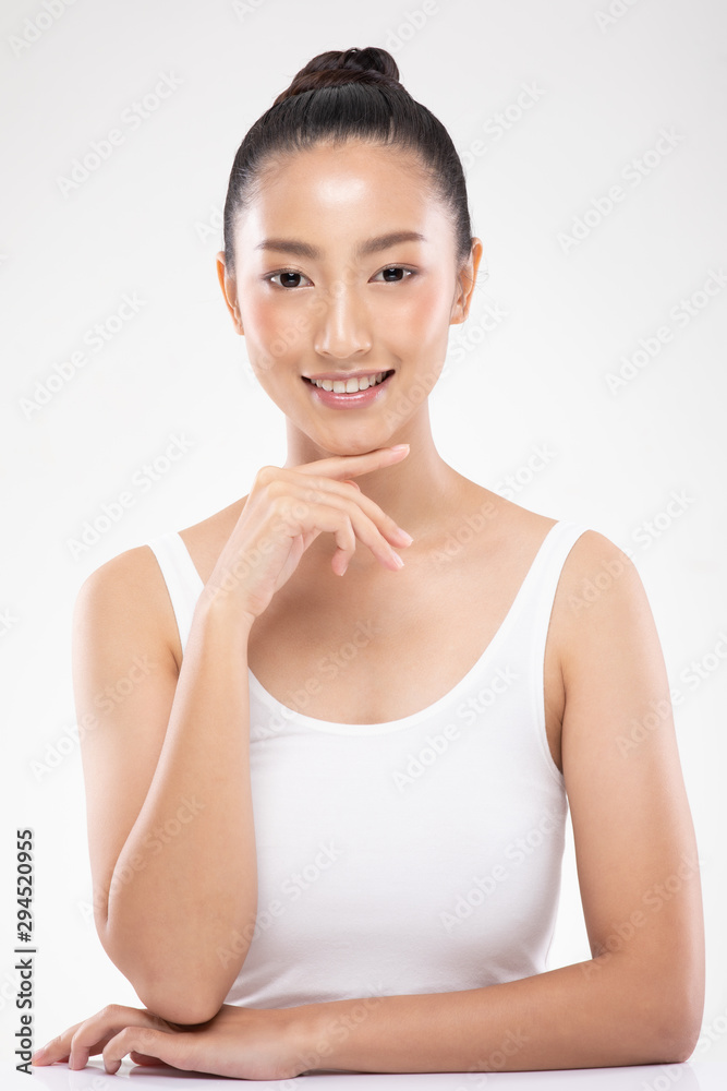 Beautiful Young Asian Woman Looking While Touching Chin feeling so happy and cheerful with healthy Clean and Fresh skin,isolated on white background,Beauty Cosmetics Concept Beautiful Young Asian Woman Looking While Touching Chin feeling so happy and cheerful with healthy Clean and Fresh skin,isolated on white background,Beauty Cosmetics Concept