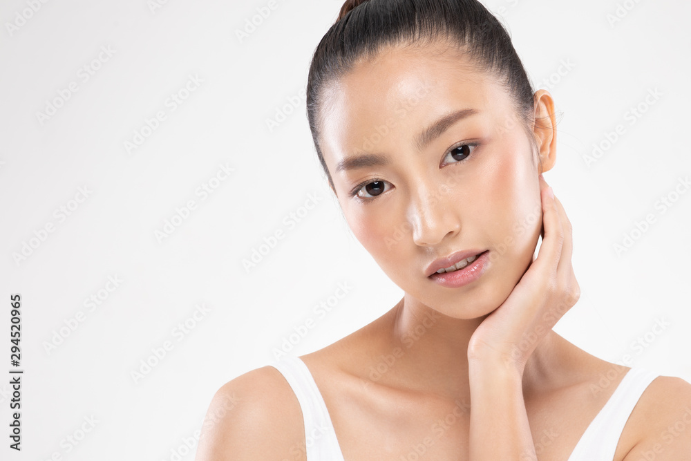 Beautiful Asian young woman touching soft cheek smile with clean and fresh skin Happiness and cheerful with positive emotional,isolated on white background,Beauty and Cosmetics Concept
