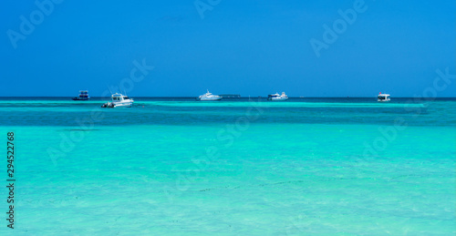 Yacht near the pier of a fabulous island in the Maldives.