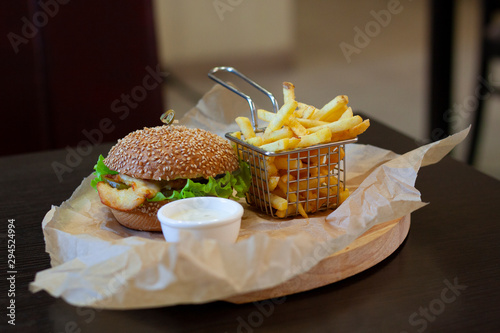 Chicken burger with chips and garlic sauce