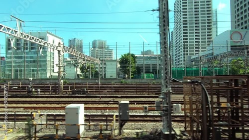 Japan Railway train window. Multiple rail and station platform