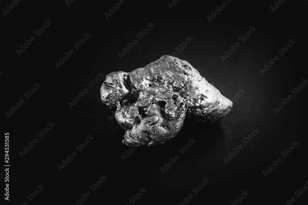 natural platinum nugget isolated on black background natural platinum nugget isolated on black background