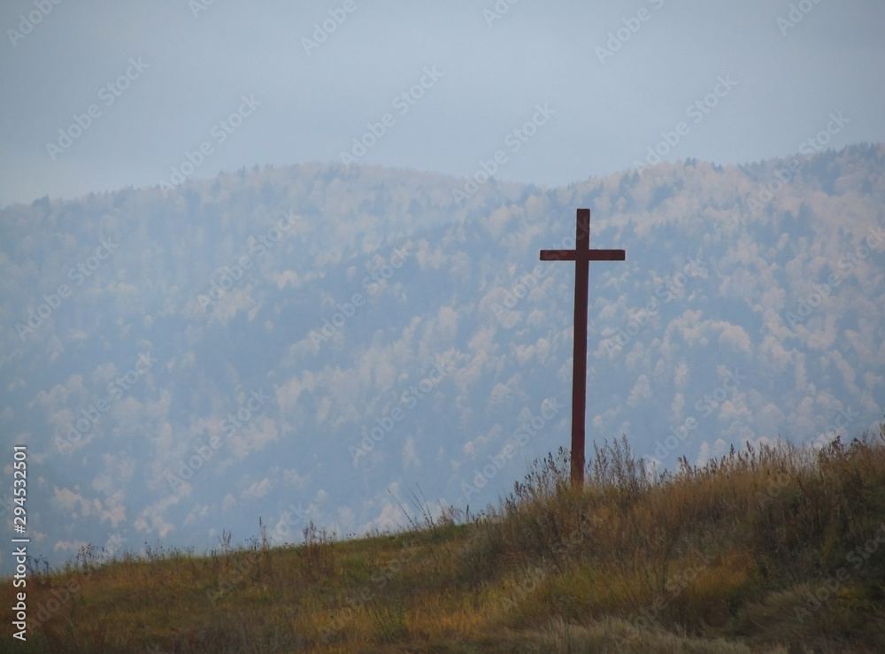 Cross on the hill. Religion and faith concept. Copy space. Cross on the background of the autumn landscape. Thanksgiving concept. Cross on the hill. Religion and faith concept. Copy space. Cross on the background of the autumn landscape. Thanksgiving concept.
