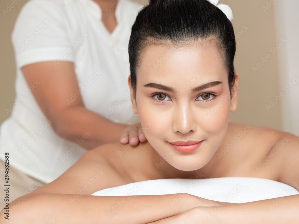 Close-up The face of beautiful young asian woman and smile on bed mattresses In the Spa. Thai massage for health. Close-up The face of beautiful young asian woman and smile on bed mattresses In the Spa. Thai massage for health.