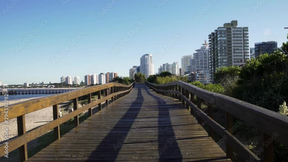Punta del Este boardwalk travelling towards city first person. Uruguay. Punta del Este boardwalk travelling towards city first person. Uruguay.