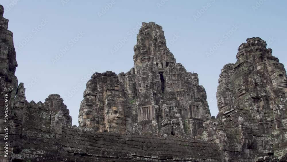A low angle moving shot showing the magnificent stones shaped into the largest religious monument in the world, Angkor Wat, a temple complex in Cambodia. A low angle moving shot showing the magnificent stones shaped into the largest religious monument in the world, Angkor Wat, a temple complex in Cambodia.