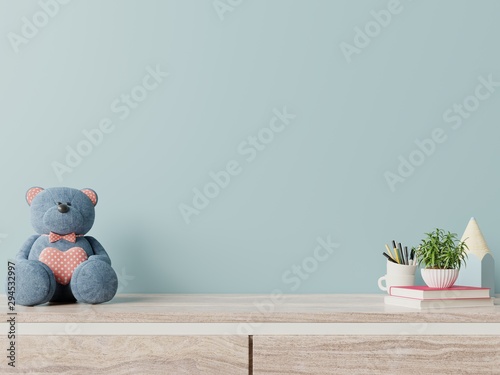 Mock up blue wall in child room interior white bear,plants on wooden floor. photo