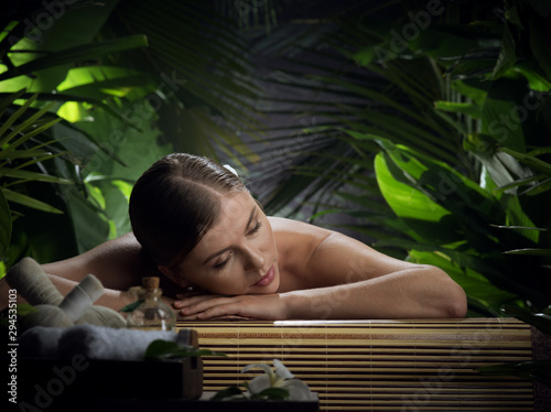 portrait of young beautiful woman in spa environment.  