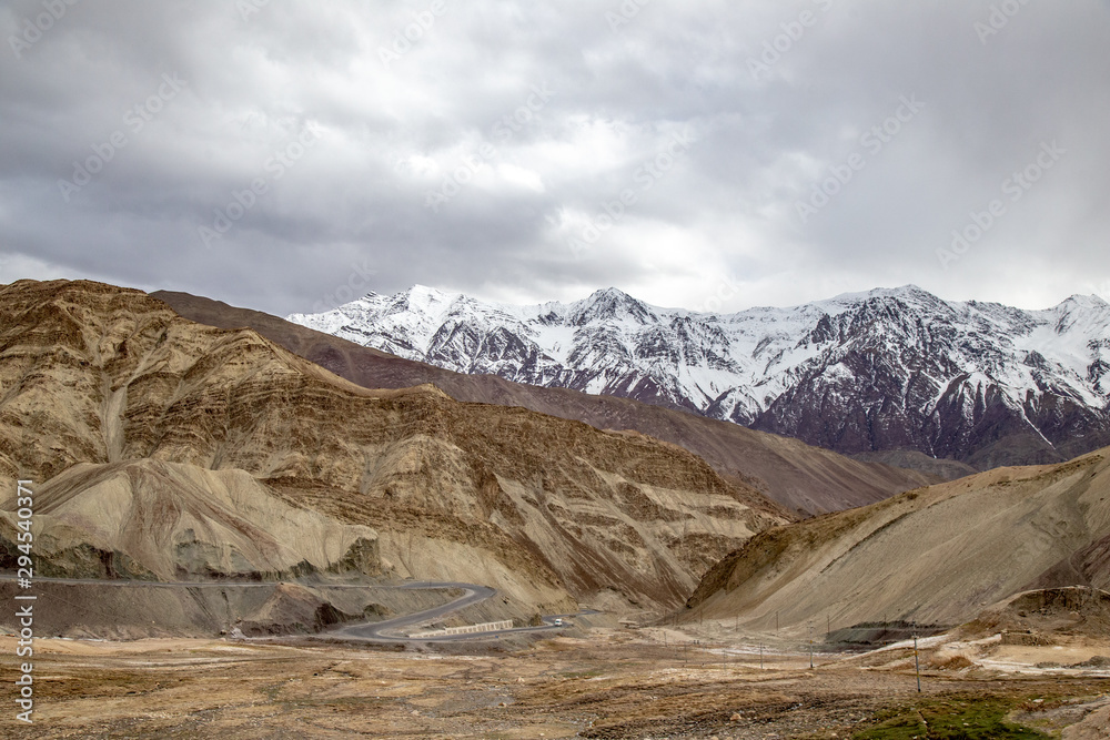 Leh Ladakh city view. Beautiful amazing village in the valley with snow mountain at background. Ladakh, India. Leh Ladakh city view. Beautiful amazing village in the valley with snow mountain at background. Ladakh, India.