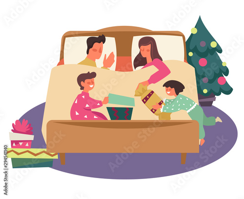 Kids opening Christmas presents in pajamas while parents sleep