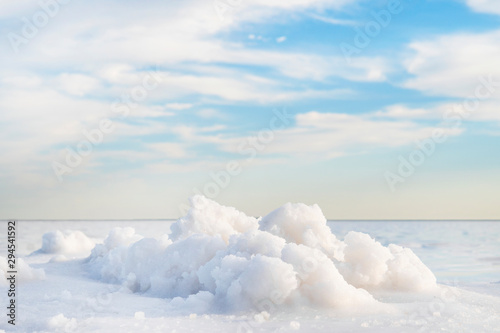 Rose water in a salt lake, extraction of sea salt - landscape background salt mining plant