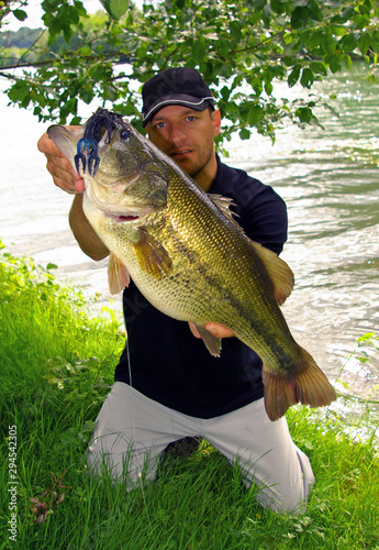 Bass fishing, man holding a big bass. Lure fishing