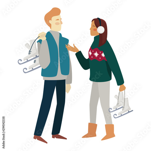 Couple on a winter date with skates before ice skating