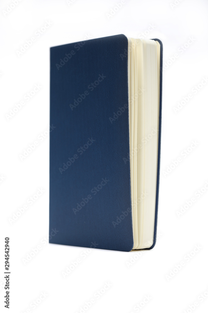 Blue diary isolated on white background. Business education concept. Office supplies. Blue diary isolated on white background. Business education concept. Office supplies.