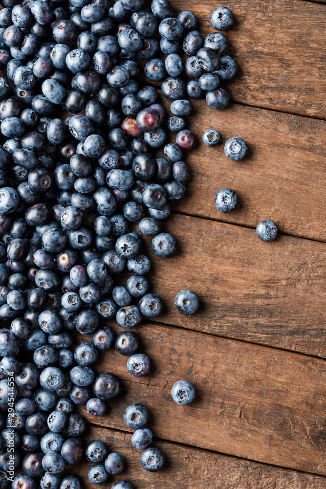 Fresh blueberries on wooden table. Top view Fresh blueberries on wooden table. Top view