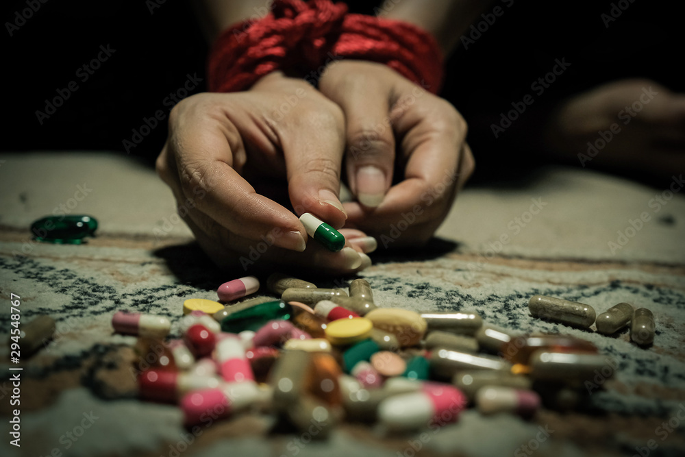 The girl kidnapped and tied with a rope. The concept used and tortured The concept of human trafficking and drug use The girl kidnapped and tied with a rope. The concept used and tortured The concept of human trafficking and drug use
