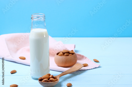 Almond milk and almonds on the table. Vegetable milk. Vegetarian milk.
